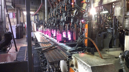 Glass bottles being formed